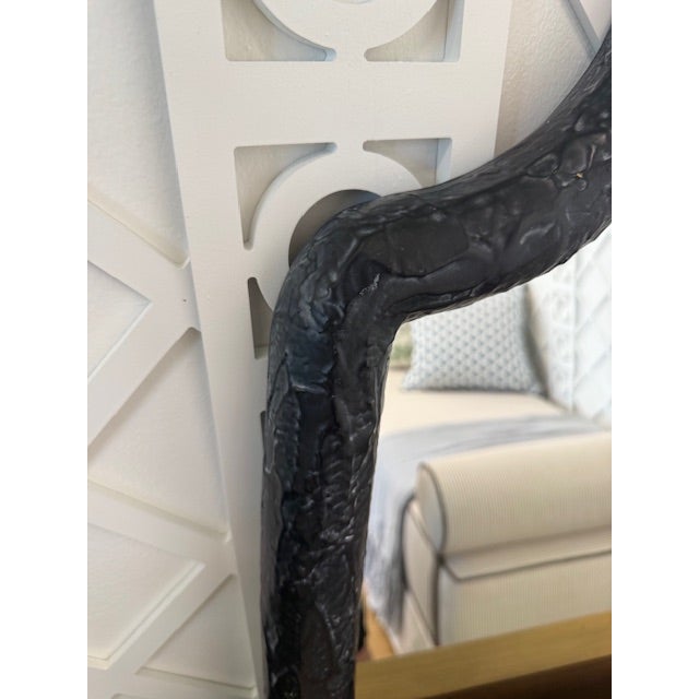 Elevate your space with this striking wall mirror, featuring a distinctive quatrefoil-inspired silhouette that adds subtle...