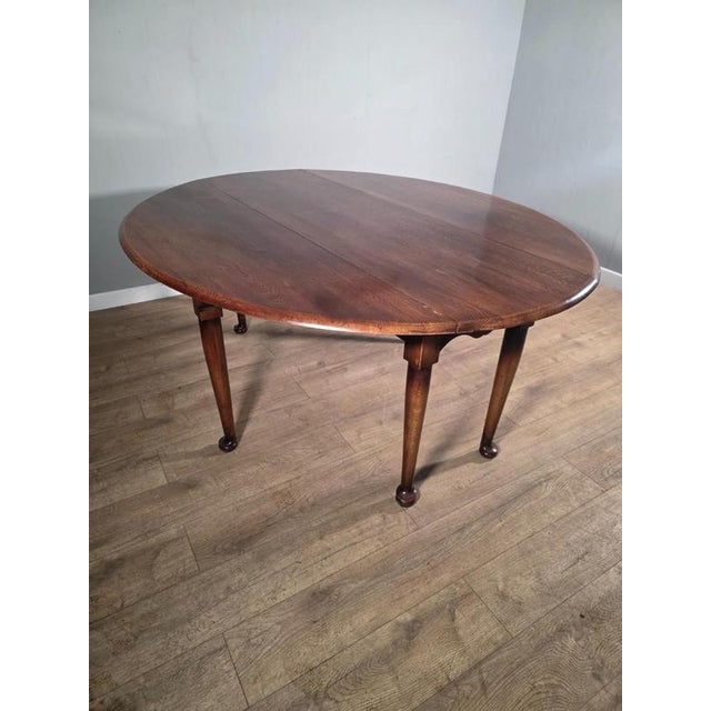 This table exudes old-world charm and elegance. Crafted from sturdy oak and featuring a classic Gateleg design, this...