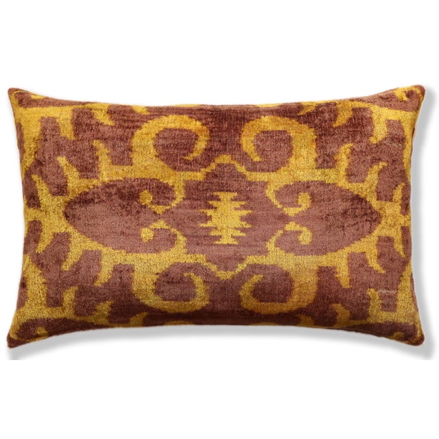 "Introduce a masterclass in texture to your seating arrangement with our Hand-Knotted Silk Velvet Ikat Lumbar Pillow. This...