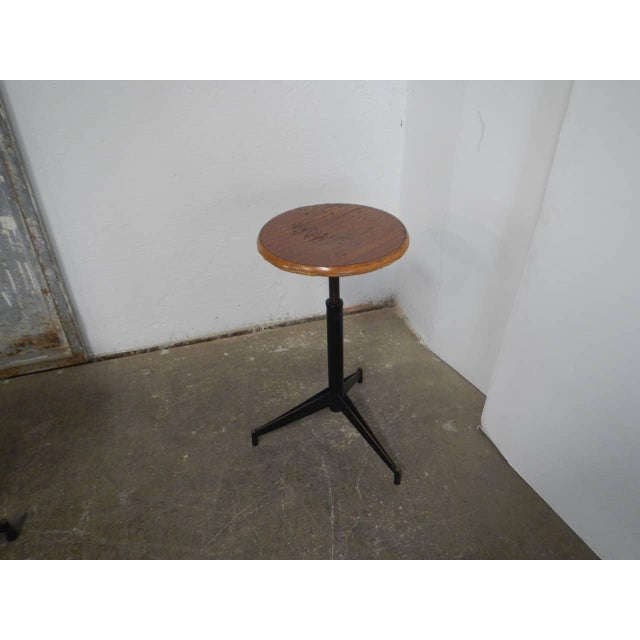 Adjustable from 49 cm to 60 cm. Signs of use on the seat. Cleaned and treated with iron varnish and wood wax.