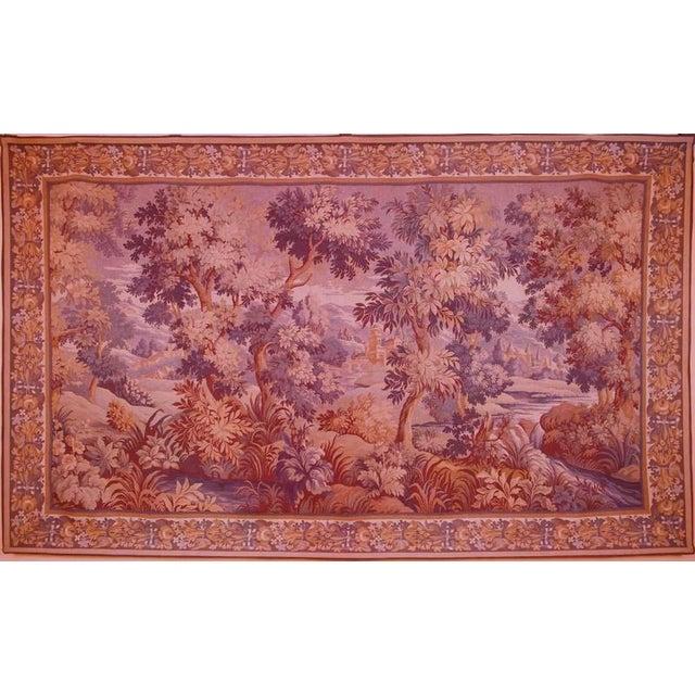 Decorative French tapestry with a romantic landscape scene, executed in soft, muted colors. The composition consists of...