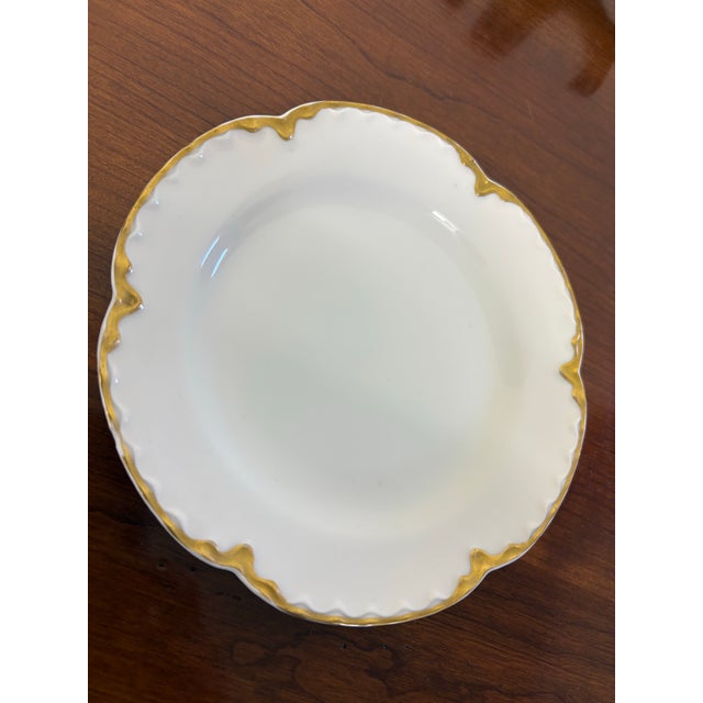 Antique Haviland Limoges of France elegant white plates with gold trim. Set has 6 plates and 6 vintage Brass LB Depose...