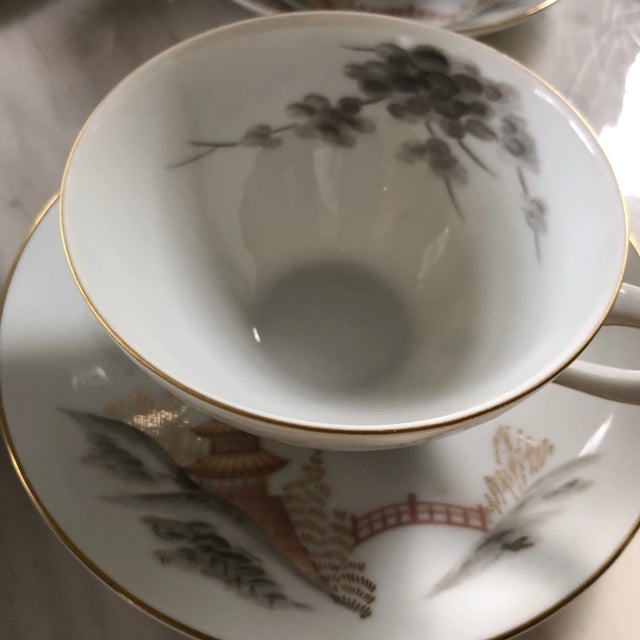 Beautiful collection of six plates and four tea cups and saucers with rose gold pagoda and cherry blossom details. Perfect...