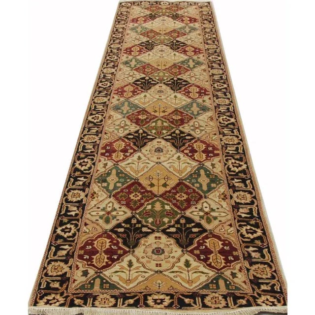 Traditional Handwoven Vegetable-dyed Persian Bakhtiari Runner Rug featuring an all-over design in a gold-colored field...