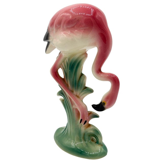 Mid-century pink and green long-legged "Searcher" flamingo ceramic figurine. The statue detailed a pink flamingo with long...