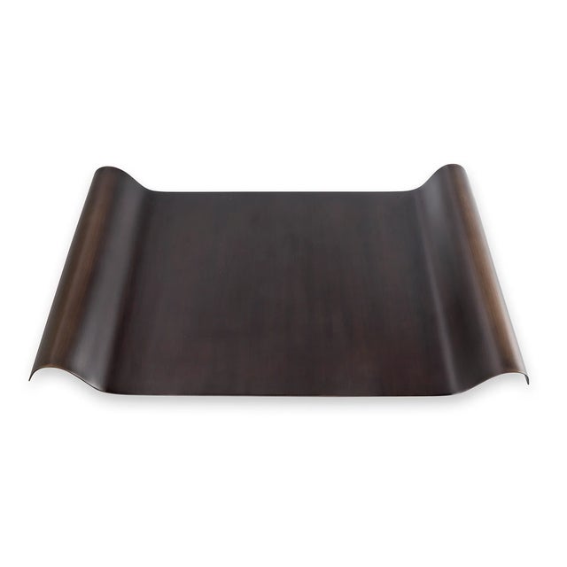 Modern with a nod toward industrial, our Quinton bronze finished metal tray is a stand out. The curved shape is accented...