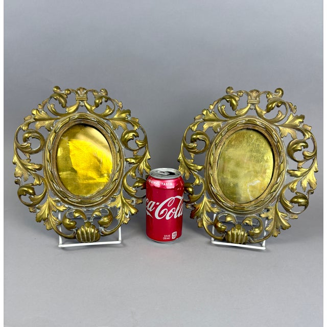 A refined and decorative pair of 19th-century French bronze d’or oval picture frames, richly cast with scrolling foliate...