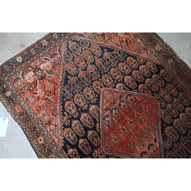 Handmade antique Persian Farahan rug in original good condition. The rug is from the beginning of 20th century made in...