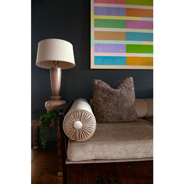 Eight horizontal bands in pastel and earth tones form shifting blocks, creating a structured yet irregular rhythm. The...