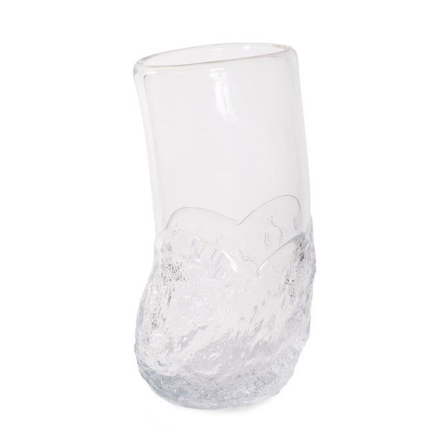 The Portage Vase stands out with its unique abstract shape and textured design, bringing a modern, artistic touch to any...