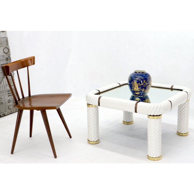 Porcelain and brass glass mirrored top side coffee table made in Italy designed by Tommaso Barbi. No visible scratches or...