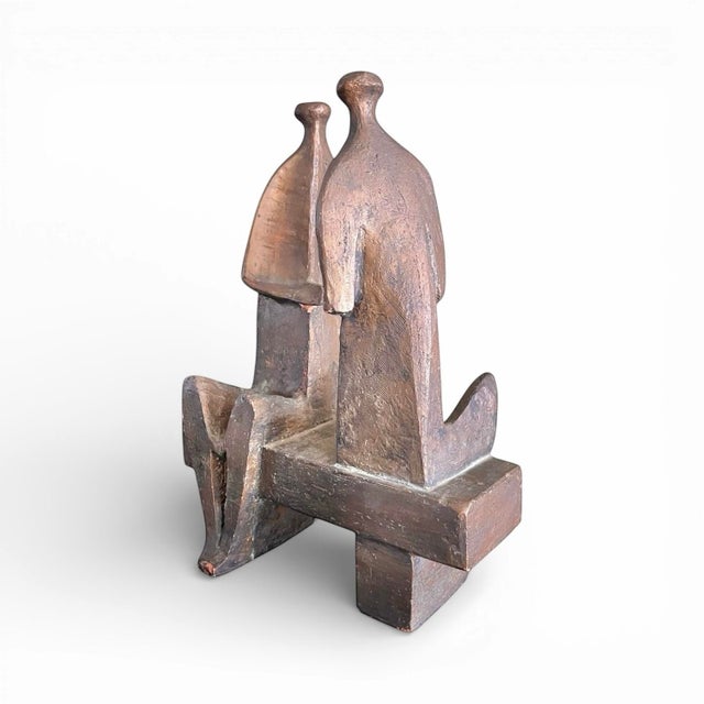 An intriguing modernist sculpture reminiscent of Henry Moore and Lynn Chadwick made of sculpted terracotta with a thick,...
