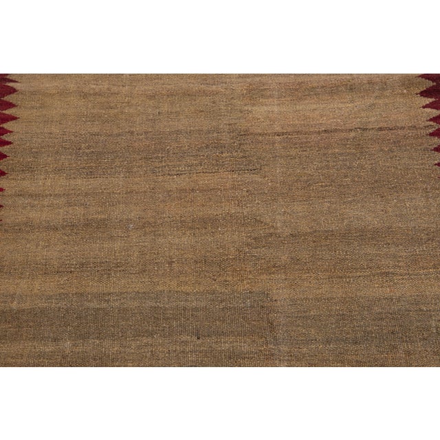 Beautiful Modern Kilim hand-knotted wool runner with multicolor accents in an all-over geometric design. This rug measures...