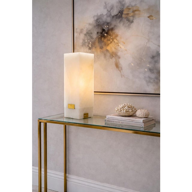 A sculptural “Covet” rechargeable table lamp designed by Kelly Wearstler for Visual Comfort & Co., executed in solid...
