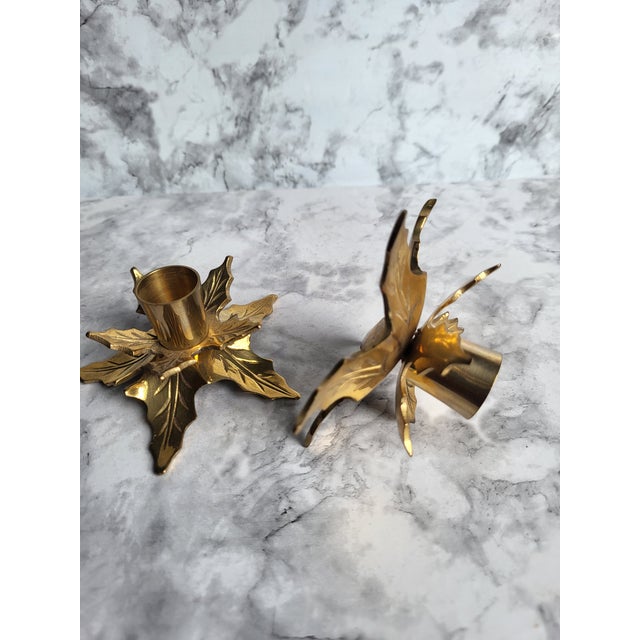 Wonderful vintage pair of solid brass figural poinsettia candlestick holders. Made in India - Circa 1980s.