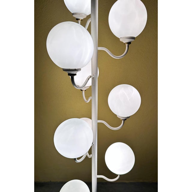 Beautiful mid-century design. 1970s floor lamp made by the German company Kaiser Leuchten. White metal base with 9 arms,...