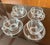Set of four vintage blown glass "Candlewick" tea cups and saucers, manufactured by the Imperial Glass Company. The set is...