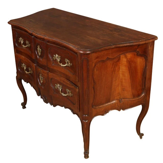 Antique French walnut two drawer commode with gilt metal mounts and hardware, carved, curved legs and shaped top