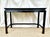 A vintage Henredon ebonized mahogany Ming style Console table or desk. The frame of solid mahogany with veneered central...