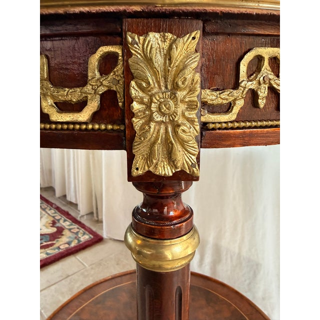 Vintage Neoclassical French Louis XVI Style Two-Tier Round Side Table with Ormolu Mounts Its in great conditions with a...