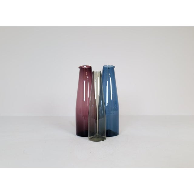 Nicely handcrafted art carafes produced by Iittala in 1956-1962 and designed by Timo Sarpaneva. Wonderful worked with a...