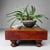 An old Japanese go-ban, a solid wooden game table for the game of Go, with a deep reddish-brown patina and a beautifully...