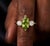 Bring a touch of fresh, vibrant elegance to your collection with this stunning three-stone ring, This design showcases a...