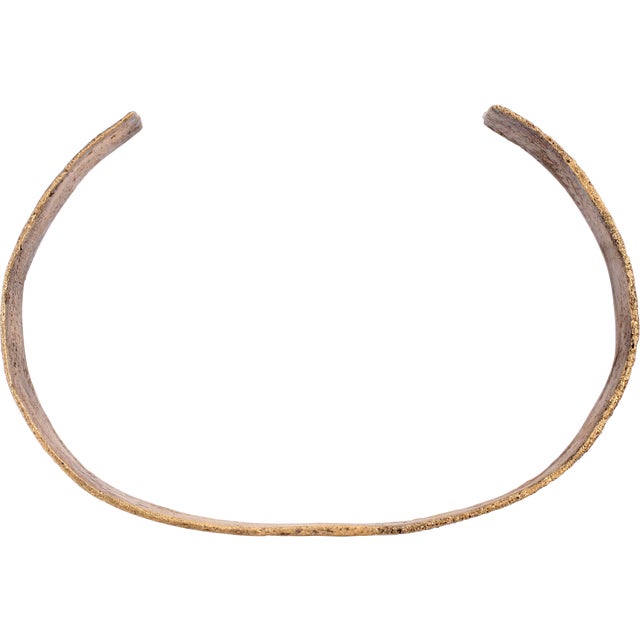 2 1/2" inside dimension which easily fits an average woman. C form, slightly tapered from its center to the ends. Gilt...