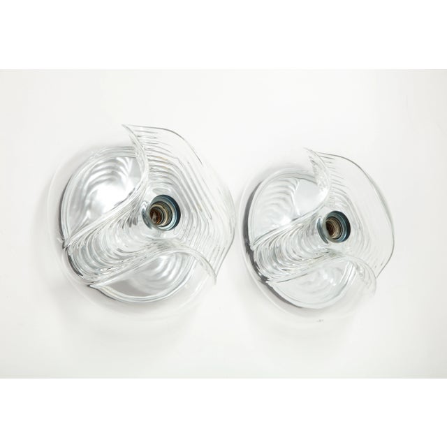Pair of extra large 1970's Wave lights by Peill and Putzler. The waved /ribbed molded glass form has a single light source...