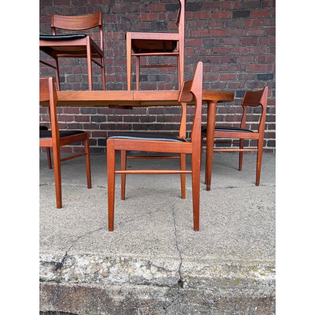 Skovmand & Andersen for Moreddi Danish Expanding Dining Table with four Leaves and 6 chairs Dimensions: Chairs: 18.75” W ×...