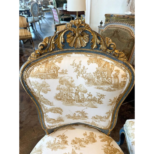 Featuring hand-carved gilding and original paint. Toile de Jouy ochre fabric.