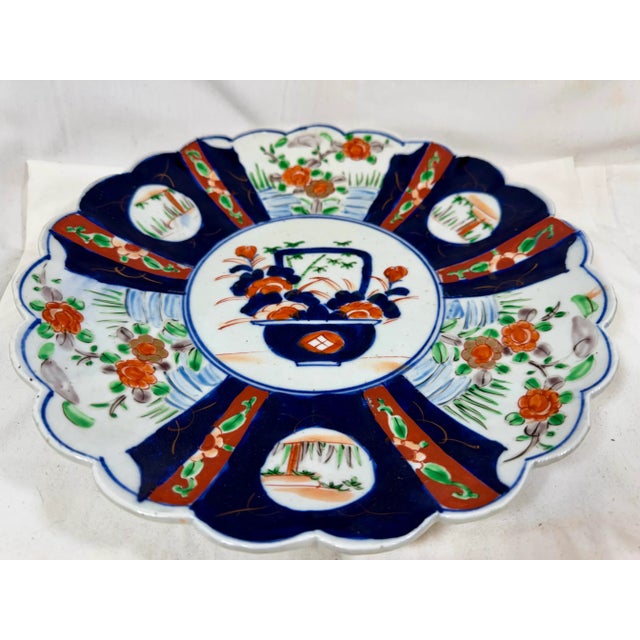 Ceramic Large Antique Scalloped Edge Porcelain Imari Plate Decorated With Rich Colored Floral & Landscape Scenes From Japan - Circa 1880 For Sale - Image 7 of 11