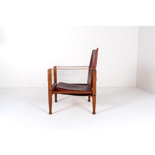 The KK47000 Safari Chair was designed by Kaare Klint in 1933 and produced by Rud Rasmussen, Denmark. Recognized as one of...