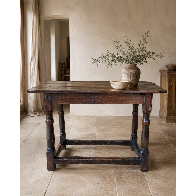 A wonderfully characterful late 17th century English oak tavern table, dating to approximately c.1680–1700. Constructed in...