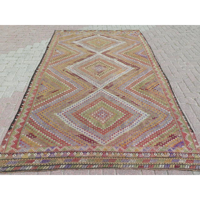 This beautiful rug is from westhern of Turkey. About 60 years old. This beautiful kilim rug Jejim weaved with embroidered...