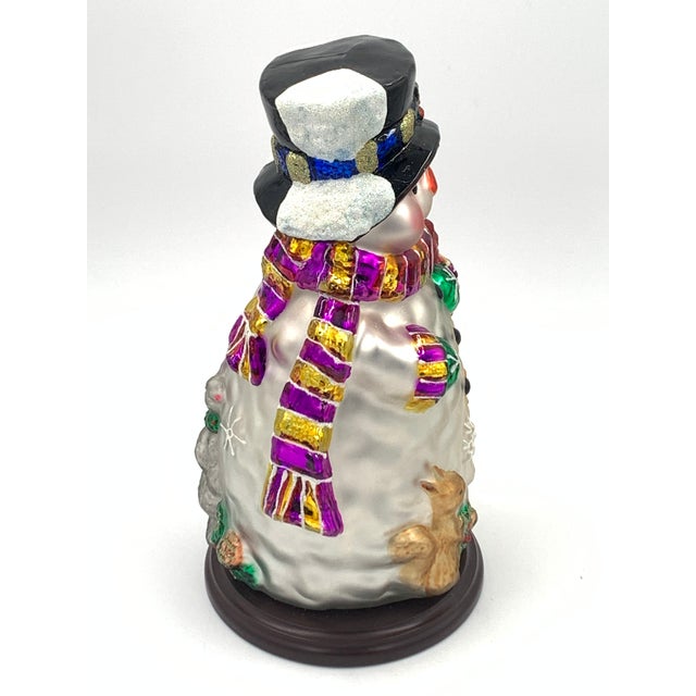This Thomas Pacconi Classics 14-inch blown glass snowman figurine is a treat! This piece features intricate details and...