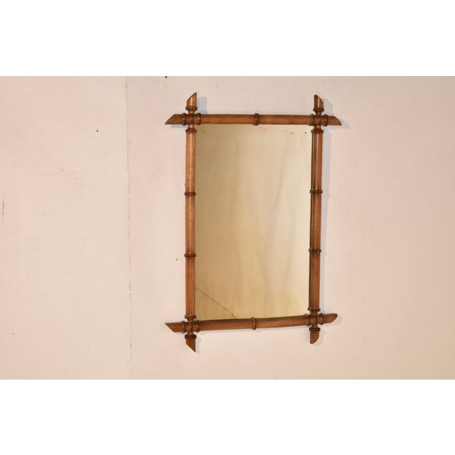 Circa 1920 cherry faux bamboo mirror from France. The frame is hand turned out of cherry to appear as if it is made from...
