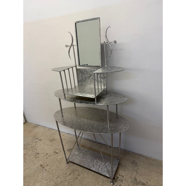 Handcrafted artisan made steel entry / foyer table or vanity with adjustable mirror, 1990s. The upper portion comes off as...