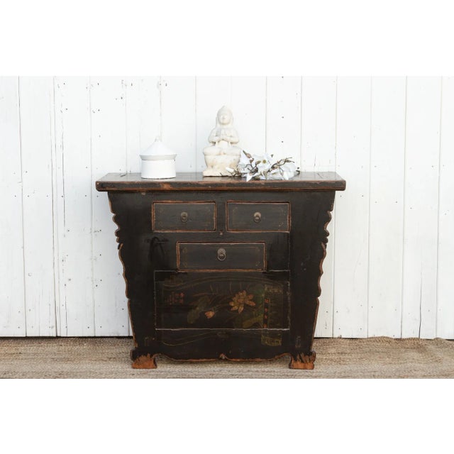 An antique Mongolian dresser cabinet, a captivating piece featuring a hand-painted black finish adorned with intricate...