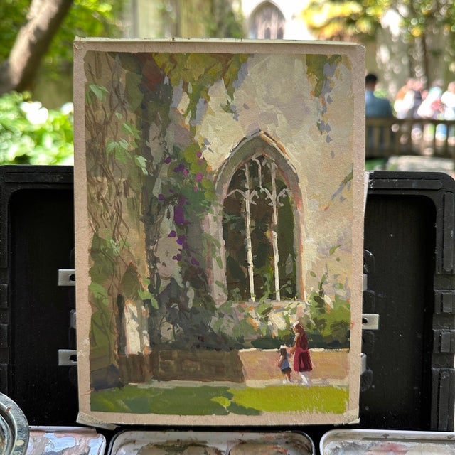 St. Dunstan Shade captures a serene moment in an outdoor setting, where a figure and a child stroll past a grand, arched...