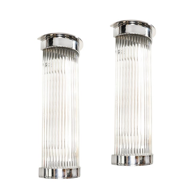 This striking pair of Art Deco Style glass rod sconces, crafted in America during the 20th century, exemplifies sleek,...