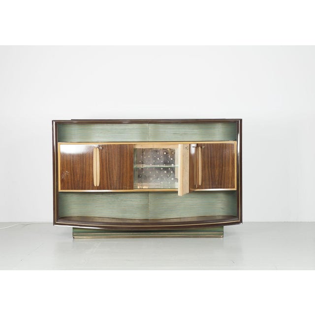 Illuminated "Mid-century" bar cabinet from the 1950s. The cabinet was designed by Vittorio Dassi and made by La Permanent...