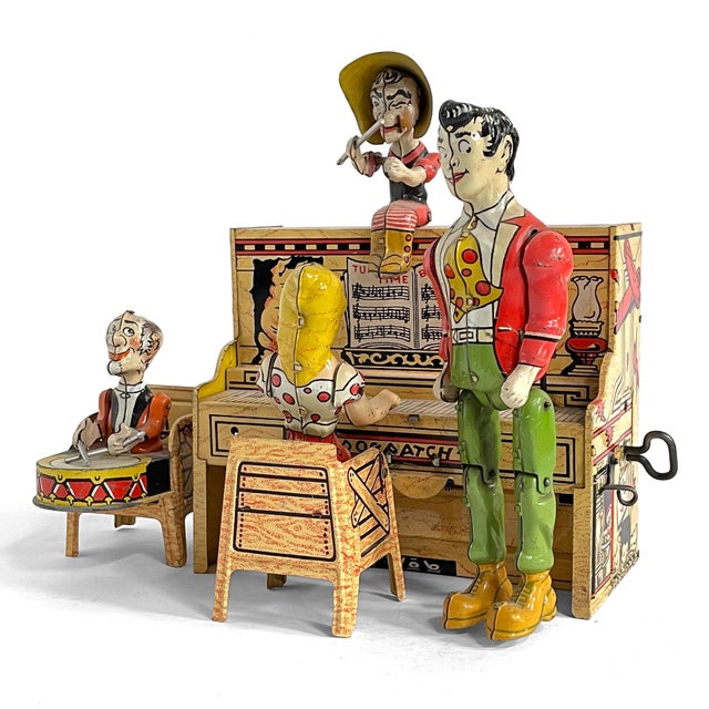 This terrific wind-up toy is called "The Dog Patch 4" and features Lil' Abner and the gang playing music and dancing. Made...