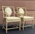 Elegant pair of rattan dining armchairs by Ficks Reed, featuring distinctive teardrop-shaped upholstered backs, gracefully...