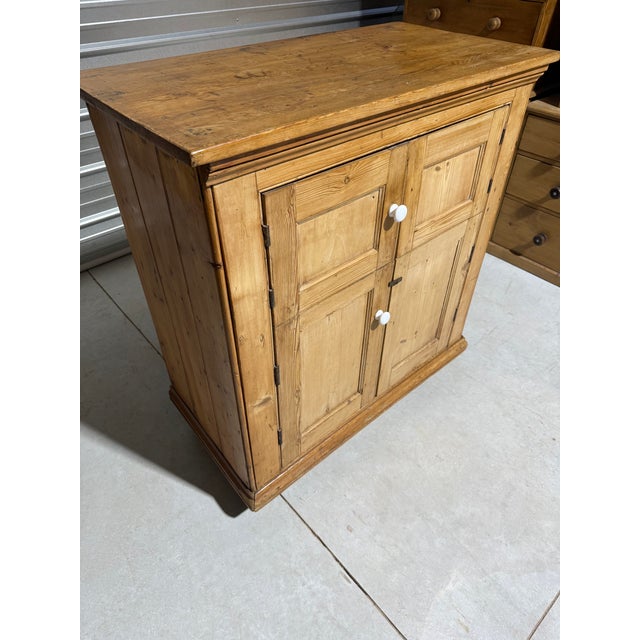 Antique Pine Cupboard With Porcelain Knobs From England We found this unique cupboard in Devon, England. Circa 1880....