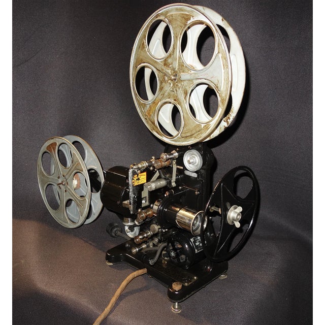 Submitted for your consideration is this circa 1916 "New Premier Pathéscope 28mm Projector". The projector is in all...