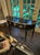 The Vintage French Jansen Design Black Lacquered Console is a stylish and elegant piece of furniture. This console exudes...