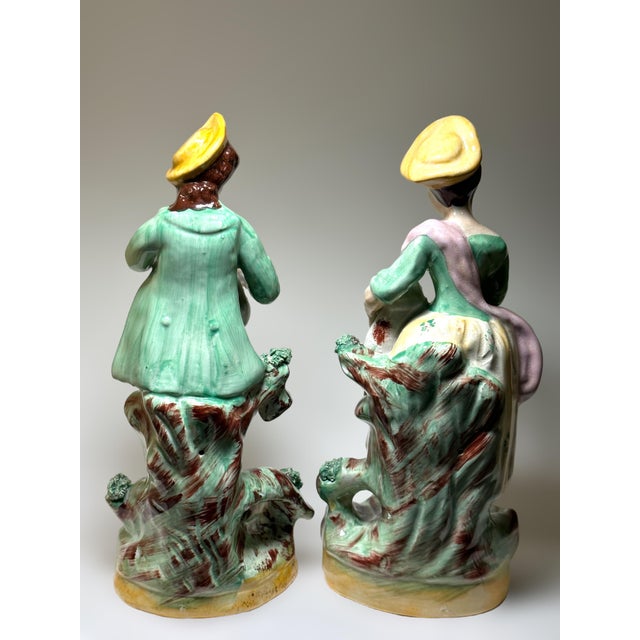 A wonderful pair of Old Staffordshire Ware England figurines. Made in the 1890’s, the figures are of a boy holding his dog...