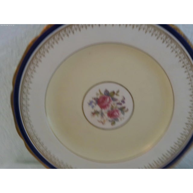 Beautiful set of eight, nicely matched English dinner plates featuring a delicate rose motif in center on cream and white...