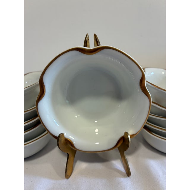 A lovely set of 11 antique Haviland & Co. Limoges porcelain bowls, each with a hand-applied gold rim and gently scalloped...